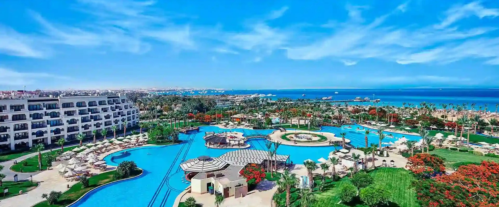 Aerial view of Steigenberger ALDAU Beach Hotel lagoon pools and the Red Sea